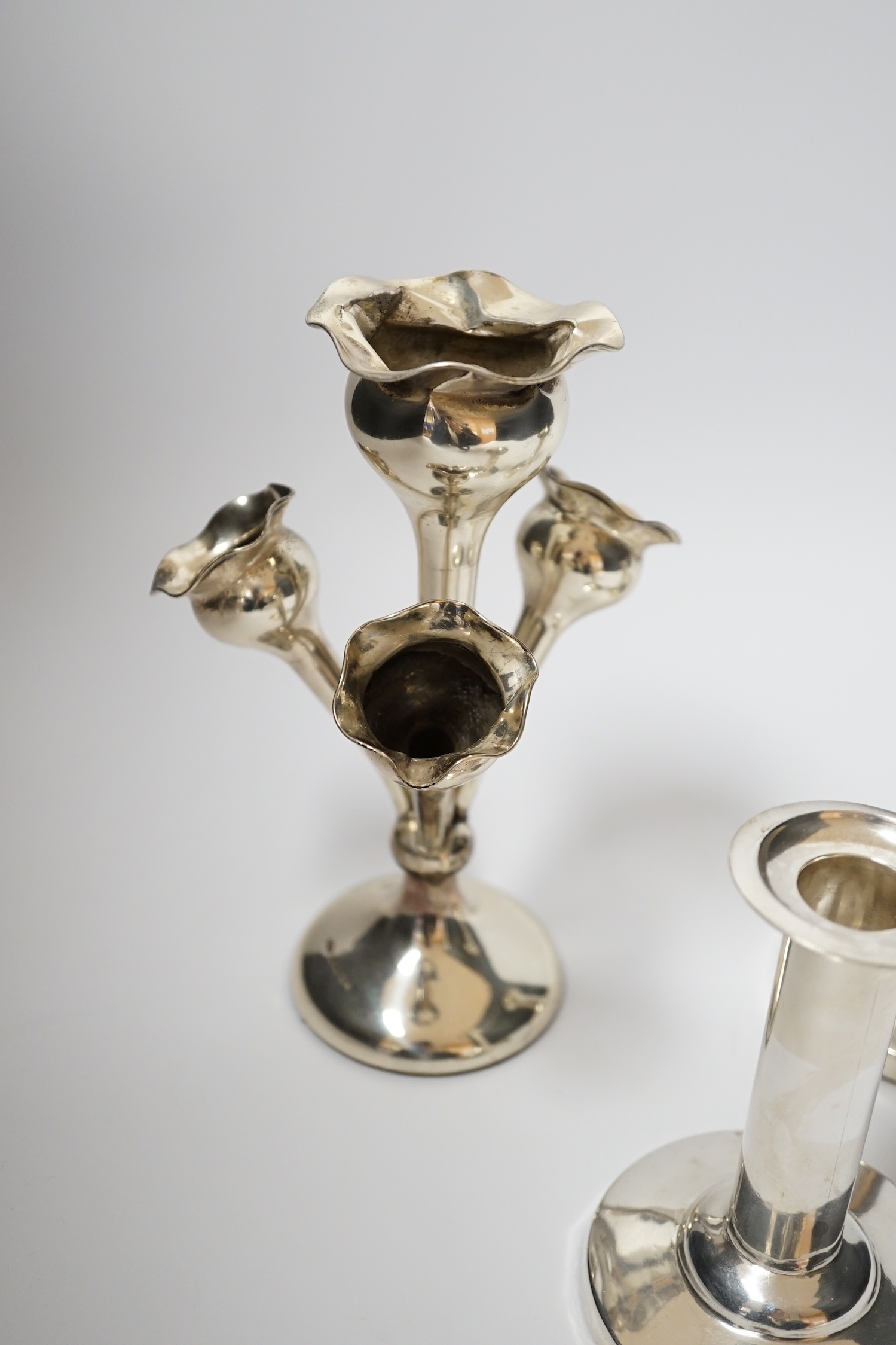 A pair of Edwardian silver mounted dwarf candlesticks, by William Hutton & Sons, London, 1904, 11cm, weighted, together with a late Victorian small silver centrepiece with four receivers.
